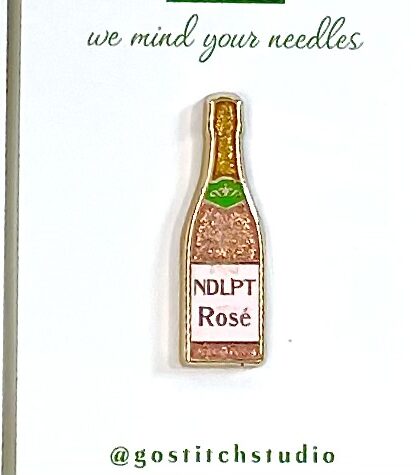 Bottle of Pink Rose Needle Minder